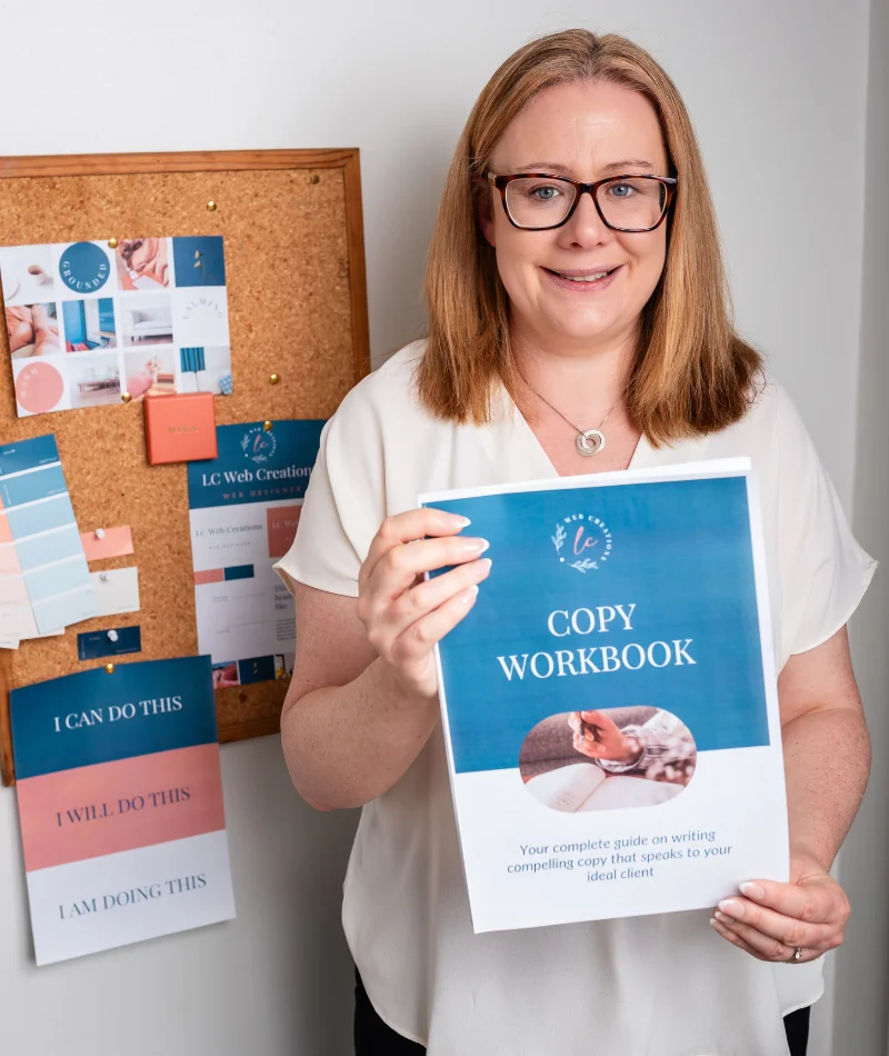 Louise Cook, Galway web designer holding up the LC Web Creations Copy Workbook in front of a branded mood board