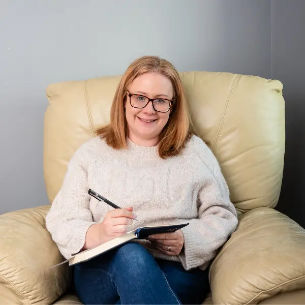 Galway web designer in a consultation, taking notes for a client website project